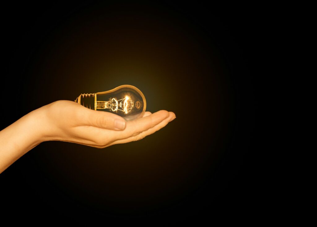 Woman holding a lightbulb