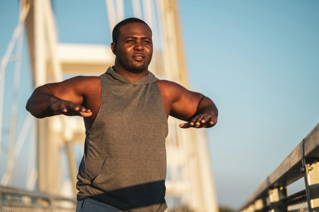 Young black man exercising.