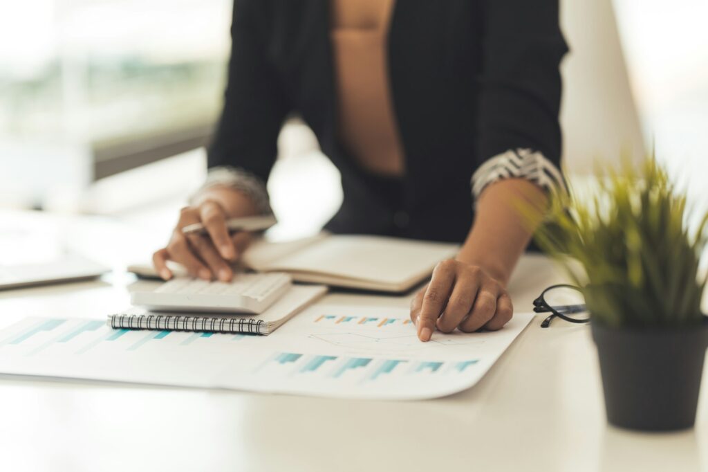 Financial Business man analyze the graph of the company's performance to create profits and growth